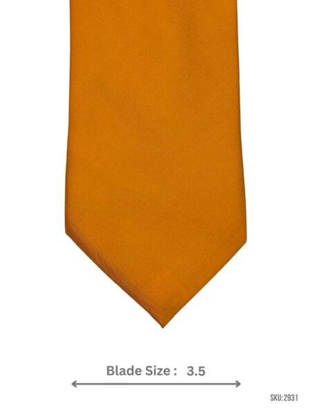 A mustard yellow tie featuring a textured square‑grid weave.