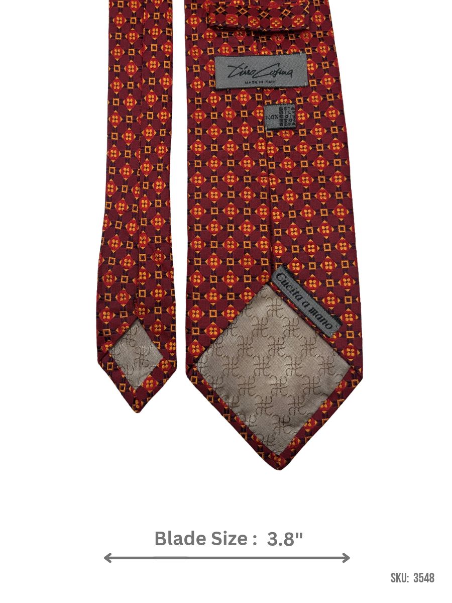 3548-1 Burgundy silk tie with red and orange geometric medallion pattern – back view showing label