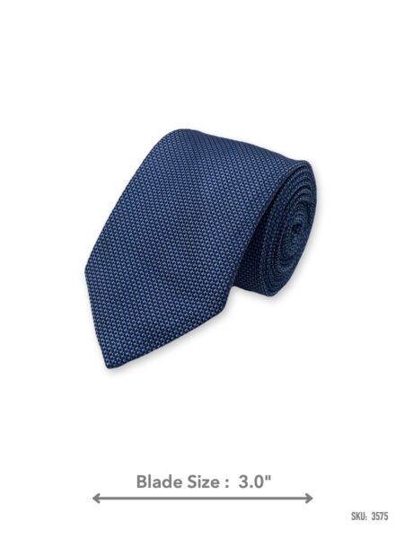 Blue silk tie with light blue micro dot pattern – rolled view
