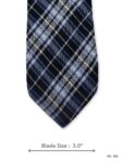 Navy blue silk tie with light blue and white plaid pattern – front blade view